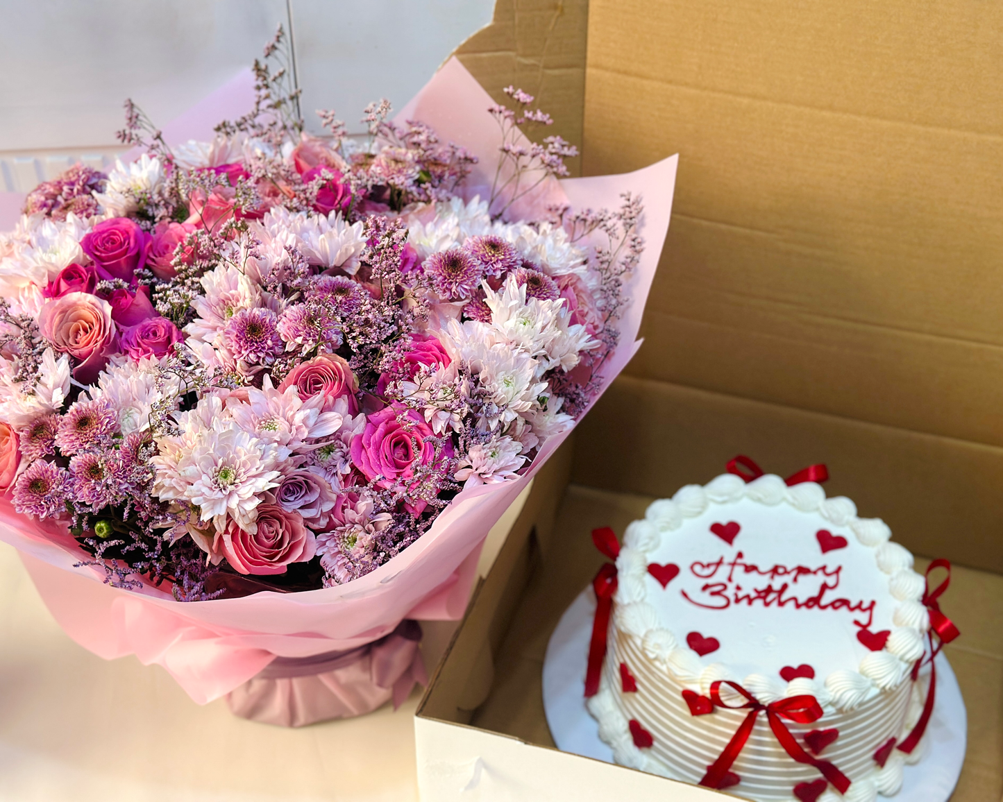 Send a Bouquet of flowers and a cake